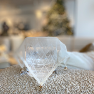 Silk cocktail veil with intricate hand-stitching, elegantly covering a glass to ensure a sophisticated and secure drinking experience