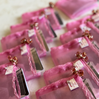 handstitched cocktail charm laid out beautifully before packing for bridesmaids presents